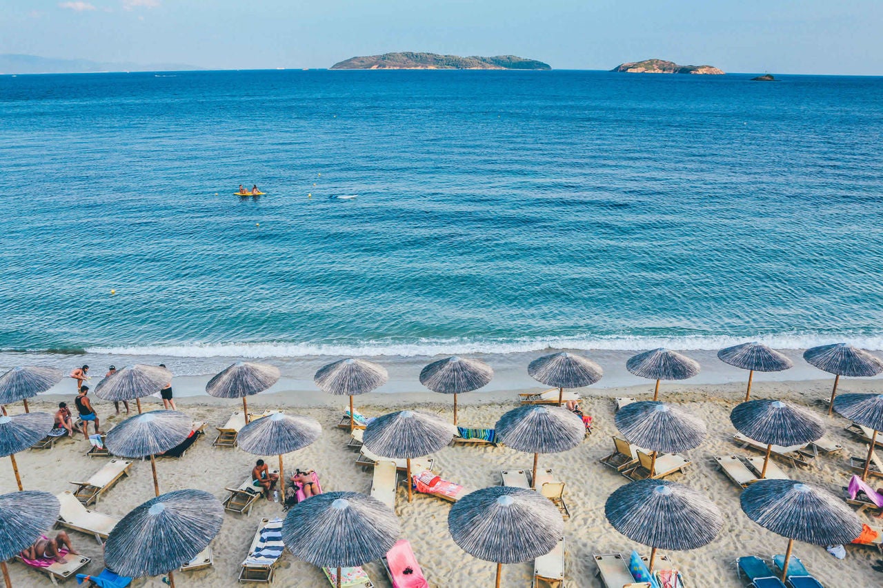 Beach with multiple umbrellas