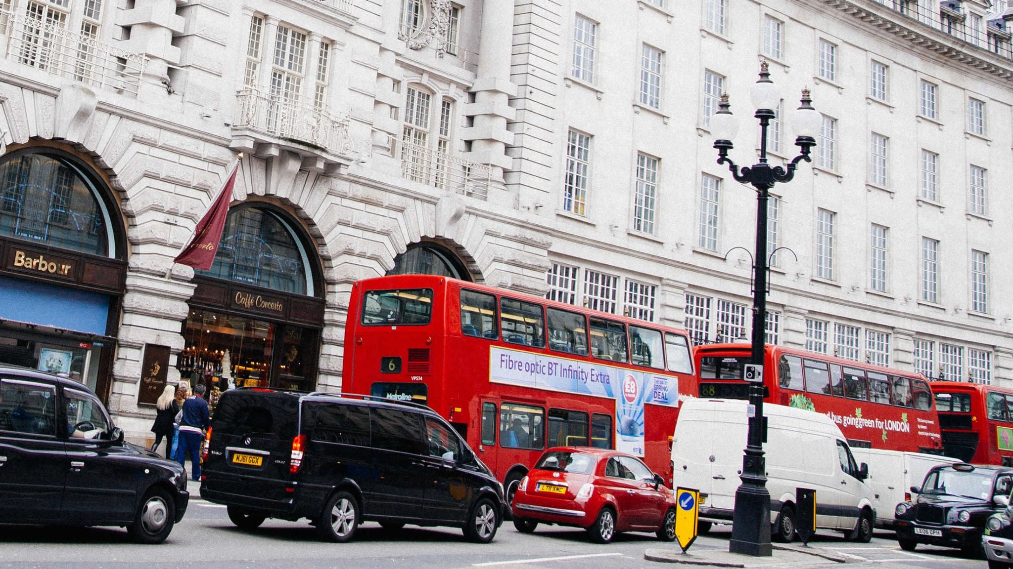 Photo of red buses in traffic in London 